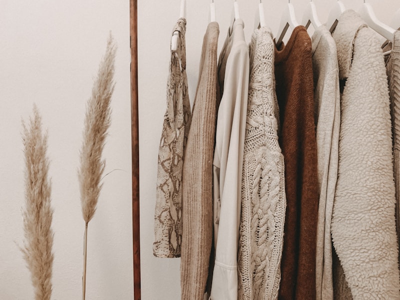 Neutral clothes on a wardrobe rail